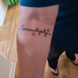 Serendipity tattoo on upper forearm Serendipity tattoo on upper forearm