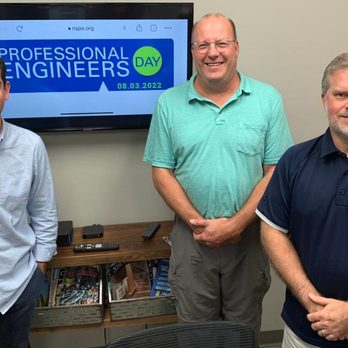 Structural Engineering & Inspections - three men standing in front of a tv - Structural Engineers Near Me - Franklin, Tennessee