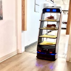 Tower Pizza - This is their awesome ai machine Rosie, bringing out our order.