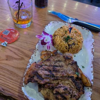 Pal Campo Restaurant - Grilled porkchop (2) with yellow rice - Latin American Near Me - Orlando, Florida