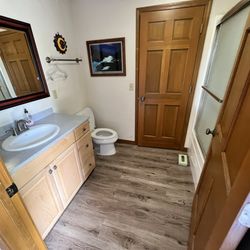 I Love Whitefish Vacation Rentals - Hanger on towel rack and trash on floor in bathroom