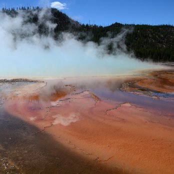 Grand Prismatic Spring - Even though the steam obscures the deep blue water underneath, the steam itself picks up some of the blue color. - Landmarks & Historical Buildings Near Me Grand Prismatic Spring - Even though the steam obscures the deep blue water underneath, the steam itself picks up some of the blue color. - Landmarks & Historical Buildings Near Me