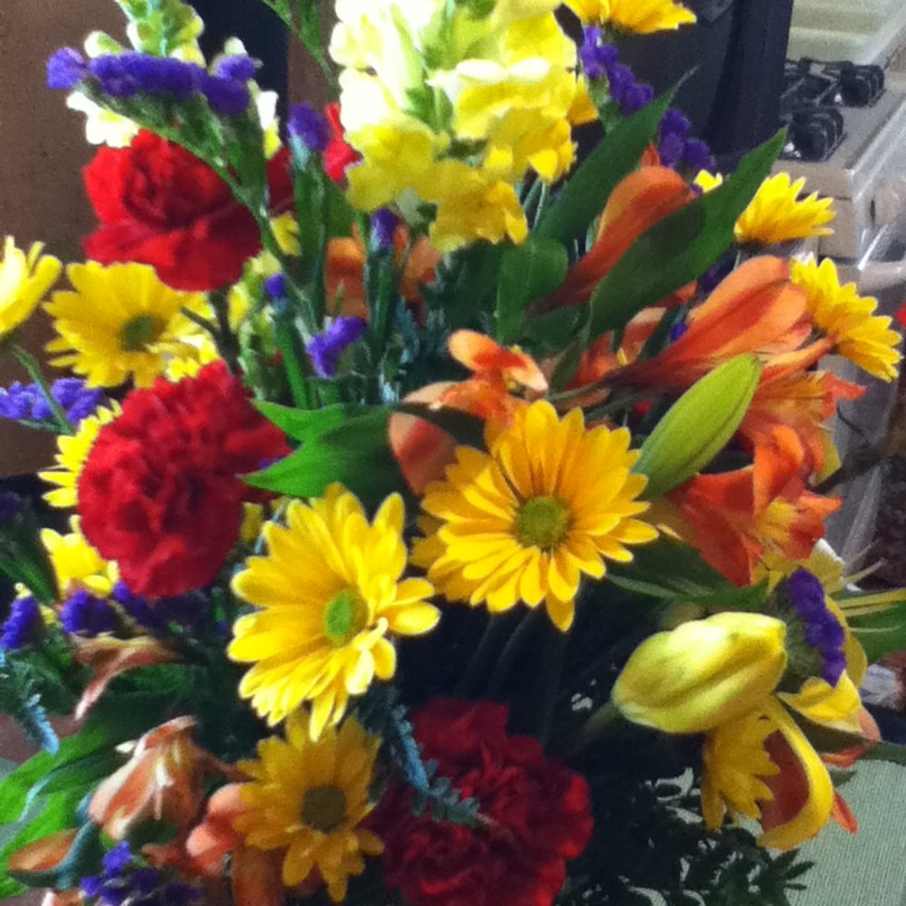 Holley's Flower & Gift Shop - Made sight unseen for my mother's birthday with the simple instructions of it being colorful and bright. I am pleased as punch. - Florists Near Me - Enfield, North Carolina