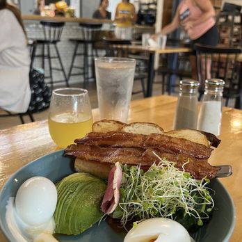 Over Easy - Brunch Bowl & Mimosa: The pairing of the homemade sourdough bread, soft boiled eggs, the tomato jam, balanced spinach, the bacon, is a 10! - Breakfast & Brunch Near Me - Kailua, Hawaii Over Easy - Brunch Bowl & Mimosa: The pairing of the homemade sourdough bread, soft boiled eggs, the tomato jam, balanced spinach, the bacon, is a 10! - Breakfast & Brunch Near Me - Kailua, Hawaii