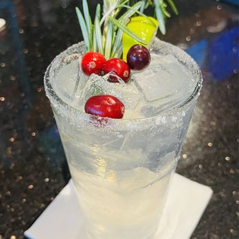 Velocity Wings - a cocktail with cranberries and rosemary garnish - Chicken Wings Near Me - Sterling, Virginia