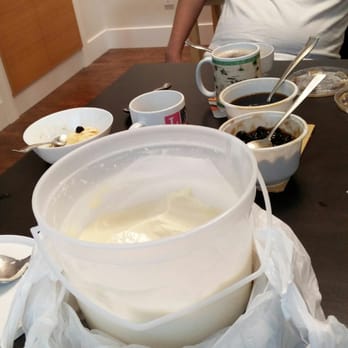 O! Taho - a man sitting at a table with bowls of food - Filipino Near Me - Vancouver, British Columbia O! Taho - a man sitting at a table with bowls of food - Filipino Near Me - Vancouver, British Columbia