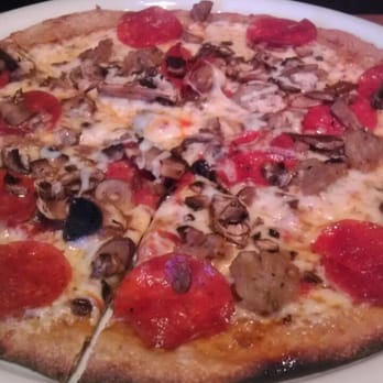 California Pizza Kitchen - Mushroom Pepperoni Sausage Pizza on honey-wheat whole grain crust - Pizza Near Me - Lone Tree, Colorado California Pizza Kitchen - Mushroom Pepperoni Sausage Pizza on honey-wheat whole grain crust - Pizza Near Me - Lone Tree, Colorado
