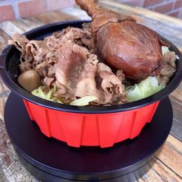 Beef Brisket Over Rice ($10.99) with Chicken Drumstick (additional $2.49)