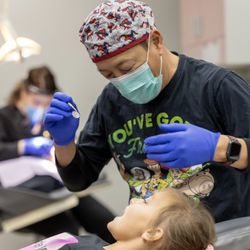 Erwin T. Su, DDS - Pediatric Dentistry - Dr. Erwin T. Su performing a dental cleaning.