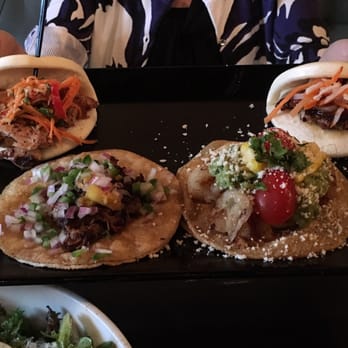 Little Bad Wolf - Left to right: chicken bao, pork taco, potato taco, and pork bao - American Near Me - Chicago, Illinois Little Bad Wolf - Left to right: chicken bao, pork taco, potato taco, and pork bao - American Near Me - Chicago, Illinois