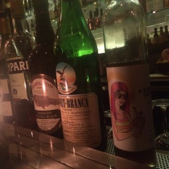 Sidecar - Just some of the bottles lined up waiting to lend depth and complexity to the mix. - Cocktail Bars Near Me - Tucson, Arizona
