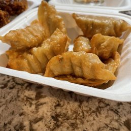 a tray of fried dumplings