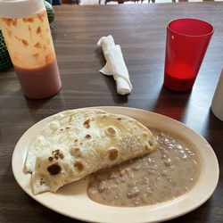 Tina's Restaurant - Bacon & egg breakfast taco and beans.