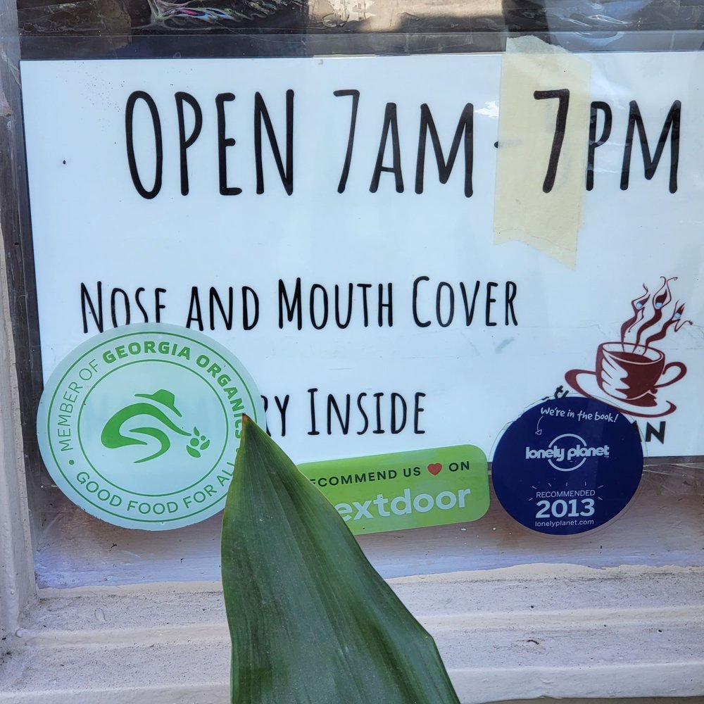 Sentient Bean - Sign in window noting that a nose and mouth cover was mandatory to enter the cafe. - Coffee & Tea Near Me - Savannah, Georgia