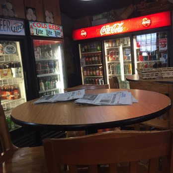 The Little Store - a table with a newspaper on it - Delis Near Me - Guilford, Connecticut The Little Store - a table with a newspaper on it - Delis Near Me - Guilford, Connecticut