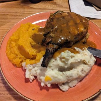 Boat House Grille - Pork chop with mashed potatoes, stuffing, butternut squash and gravy - Seafood Near Me - Essex, Massachusetts Boat House Grille - Pork chop with mashed potatoes, stuffing, butternut squash and gravy - Seafood Near Me - Essex, Massachusetts