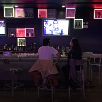 LiqrBox - two people sitting at a bar - Dance Clubs Near Me - Chicago, Illinois