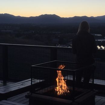 Acreage - Deck fire pits on as the sun set - Cideries Near Me - Lafayette, Colorado Acreage - Deck fire pits on as the sun set - Cideries Near Me - Lafayette, Colorado