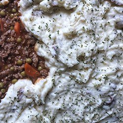 It's Chef Jess - Traditional shepherd's pie layered with beef and vegetables topped with smashed potatoes. Served with yeast rolls.
