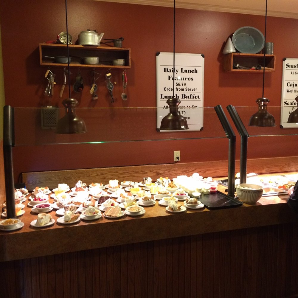 Cedar Tree Restaurant - a woman standing in front of a buffet - Steakhouses Near Me - Jasper, Texas