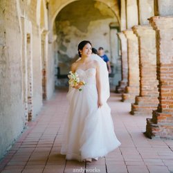 Elegant bridal hair and makeup created to complement the bride's dress, features, and personal style