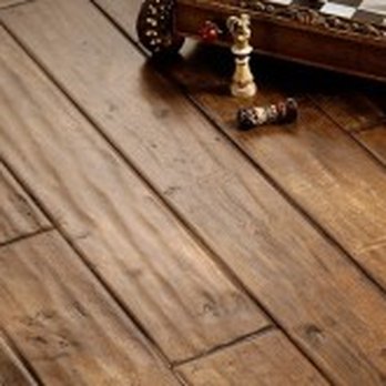 Hallmark - a wooden floor with chess pieces on it - Carpeting Near Me - Wyckoff, New Jersey