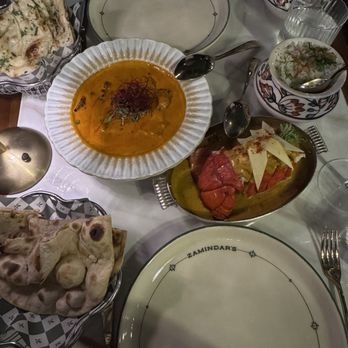 Zamindar’s - OLD DELHI BUTTER CHICKEN, CALICUT MANGO LOBSTER CURRY, TANDOORI ROTI, GARLIC & CILANTRO NAAN - Indian Near Me - Charlotte, North Carolina Zamindar’s - OLD DELHI BUTTER CHICKEN, CALICUT MANGO LOBSTER CURRY, TANDOORI ROTI, GARLIC & CILANTRO NAAN - Indian Near Me - Charlotte, North Carolina