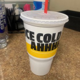 a cold drink in a plastic cup