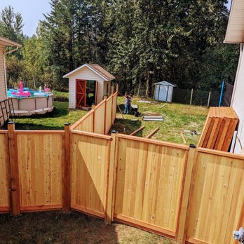 Zelda Fences & Landscaping - a backyard with a wooden fence - Fences & Gates Near Me Zelda Fences & Landscaping - a backyard with a wooden fence - Fences & Gates Near Me