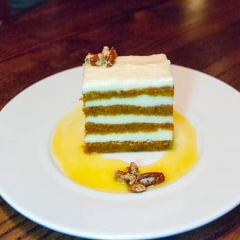 Goldfinch Tavern - Carrot Layer Cake. Area cheese frosting, orange cardamom coulis. - Seafood Near Me - Seattle, Washington Goldfinch Tavern - Carrot Layer Cake. Area cheese frosting, orange cardamom coulis. - Seafood Near Me - Seattle, Washington