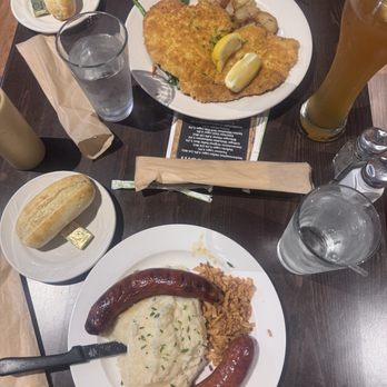 Die Bierstube Restaurant - Smoked bratwurst and hot polish with mashed potatoes and pork schnitzel. - Cocktail Bars Near Me - Brea, California