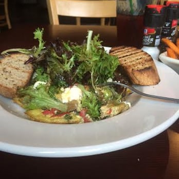 The Cafe - Frittata of the day. OMG, so GOOD! The bread was hearty, the frittata was stuffed with veggies and cheese and topped with greens - Sandwiches Near Me - Key West, Florida The Cafe - Frittata of the day. OMG, so GOOD! The bread was hearty, the frittata was stuffed with veggies and cheese and topped with greens - Sandwiches Near Me - Key West, Florida
