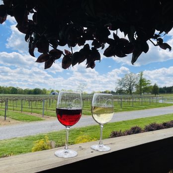 Woodmill Winery - two glasses of wine on a porch - Wineries Near Me - Vale, North Carolina