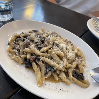 Beba - a plate of pasta with mushrooms and parmesan cheese - Argentine Near Me - Montreal, Quebec
