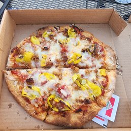 Thin crust Spartan sausage onion and pepper pizza. Thin crust Spartan sausage onion and pepper pizza.