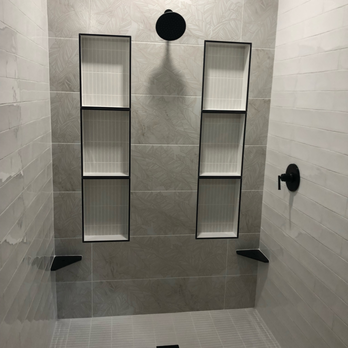 Flooring Pros - Customized tile flooring installation with textured gray tiles and integrated niche shelving for added storage. Ideal for modern bathroom. - Flooring Near Me - Murrieta, California Flooring Pros - Customized tile flooring installation with textured gray tiles and integrated niche shelving for added storage. Ideal for modern bathroom. - Flooring Near Me - Murrieta, California