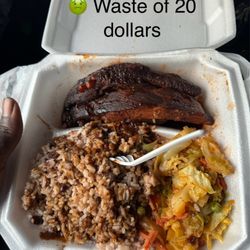 Caribbean Jerk Restaurant and Lounge - (Not cleaned) Jerk ribs really brown stew smell so raw can't even eat