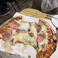 Jake's Pizza - Passing through town. BEST pizza we have had in a long time! Don't let the outside fool you - great hole-in-the-wall place!