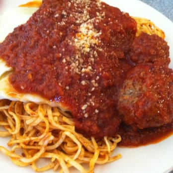 Mama Z's Cafe - The "Italian Plate" with spaghetti, two chicken-stuffed ravioli and meatballs.   It come with salad, garlic toast and rolls. - Italian Near Me - Tontitown, Arkansas