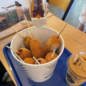 Frankseoul - Dalgona Milk Coffee, cream cheese dog with grape jelly on top, and bucket of various dogs! - Hot Dogs Near Me - Frisco, Texas Frankseoul - Dalgona Milk Coffee, cream cheese dog with grape jelly on top, and bucket of various dogs! - Hot Dogs Near Me - Frisco, Texas