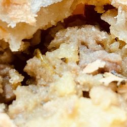 Little Red Hen Bakery - Close up of flaky meat pie crust and stuffing.
