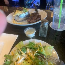 Buzz Inn Steakhouse - Steak, baked potato, and salad