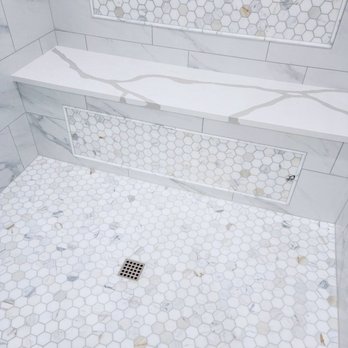 Restoration & Remodeling - a shower with hexagon tile - Damage Restoration Near Me Restoration & Remodeling - a shower with hexagon tile - Damage Restoration Near Me
