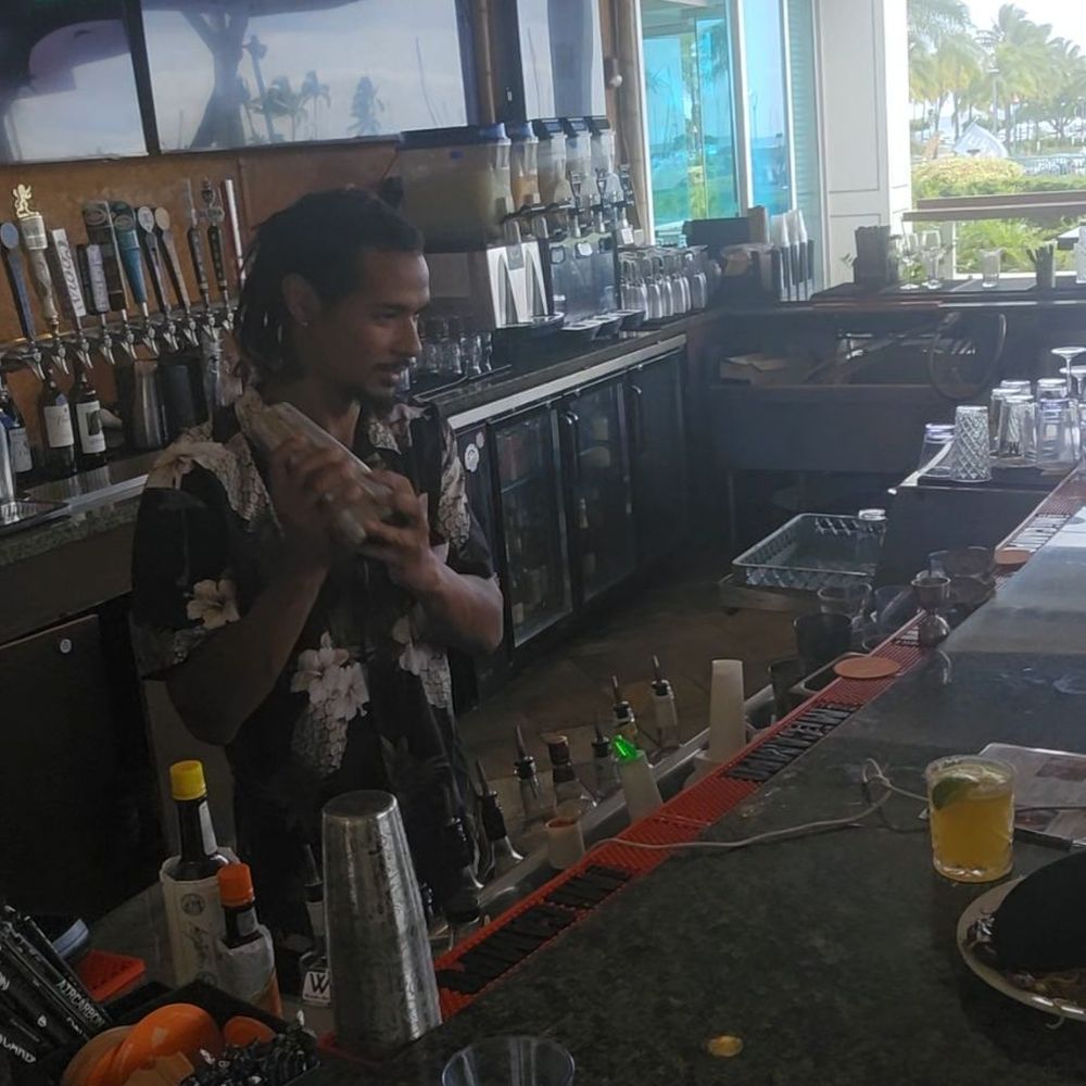 Menehune Grille - Eli shaking some drinks - Venues & Event Spaces Near Me - Honolulu, Hawaii Menehune Grille - Eli shaking some drinks - Venues & Event Spaces Near Me - Honolulu, Hawaii