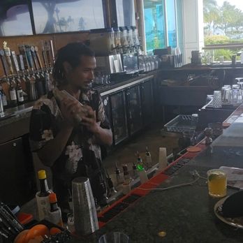 Menehune Grille  - Eli shaking some drinks - Venues & Event Spaces Near Me - Honolulu, Hawaii
