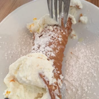 Cavalli Cafe - He filled the connolli as we waited so we decided to eat it here. Lol! - Coffee & Tea Near Me - San Francisco, California