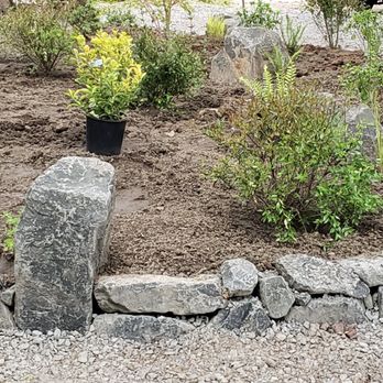 Exstream Landscaping - Island that had been just a large ivy patch.  Basalt rock surround and beautiful plantings. - Irrigation Near Me - Oregon City, Oregon
