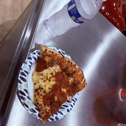 Costco - Slice of pizza and a bottle of water for less than $3-a Costco bargain!