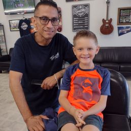 Barber Allen with a happy customer.