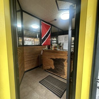 Suzy's Roti Parlour - Entrance, it's a small shop you just go in to order, but there is outdoor seating on the side - Trinidadian Near Me - Brooklyn, New York Suzy's Roti Parlour - Entrance, it's a small shop you just go in to order, but there is outdoor seating on the side - Trinidadian Near Me - Brooklyn, New York